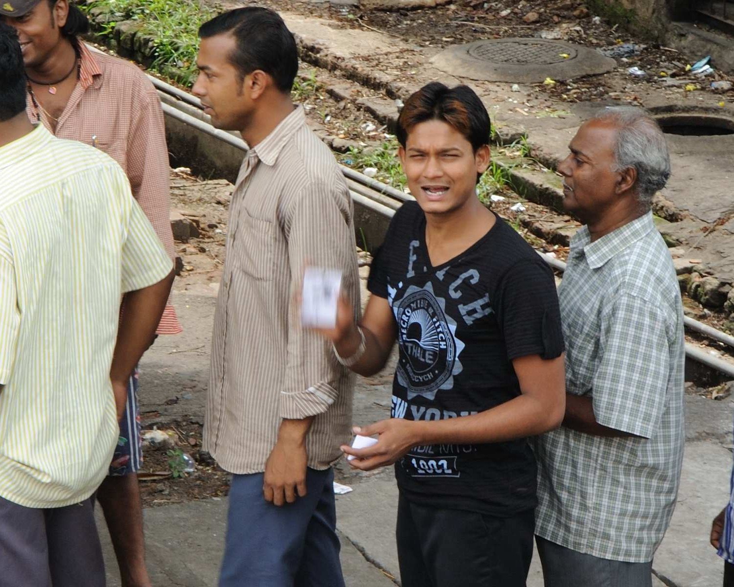 Indian voters and citizens gathered in a polling queue